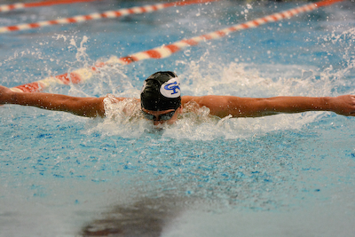 Swimming and diving teams split with Columbus East cover photo