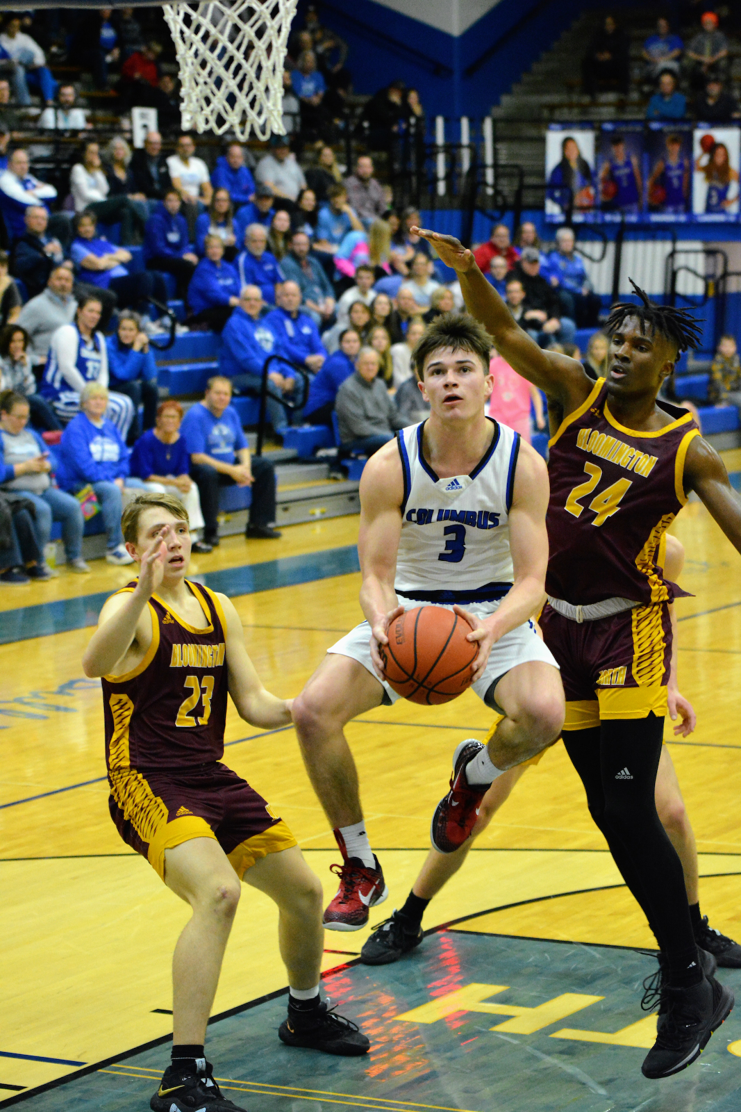Dogs fall to Cougars 49-45 in boys basketball cover photo