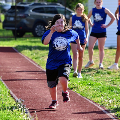Dogs show improvement in Unified Track at Columbus East cover photo