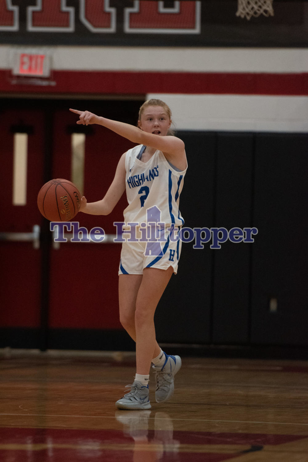 Freshman-Kaylee-Mills-dribbles-the-ball-down-the-court-and-calling-out-the-play-at-the-Walton-Verona-game.-Liam.png
