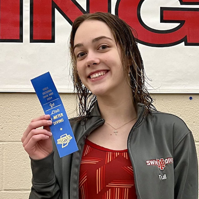 Tull wins title, girls swimmers sectional runners-up cover photo
