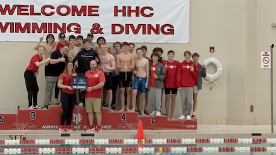 Boys swimming wins HHC title cover photo